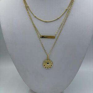 New 3 tiered chain necklace with medallion ,good luck eye, bar charm, gold tones